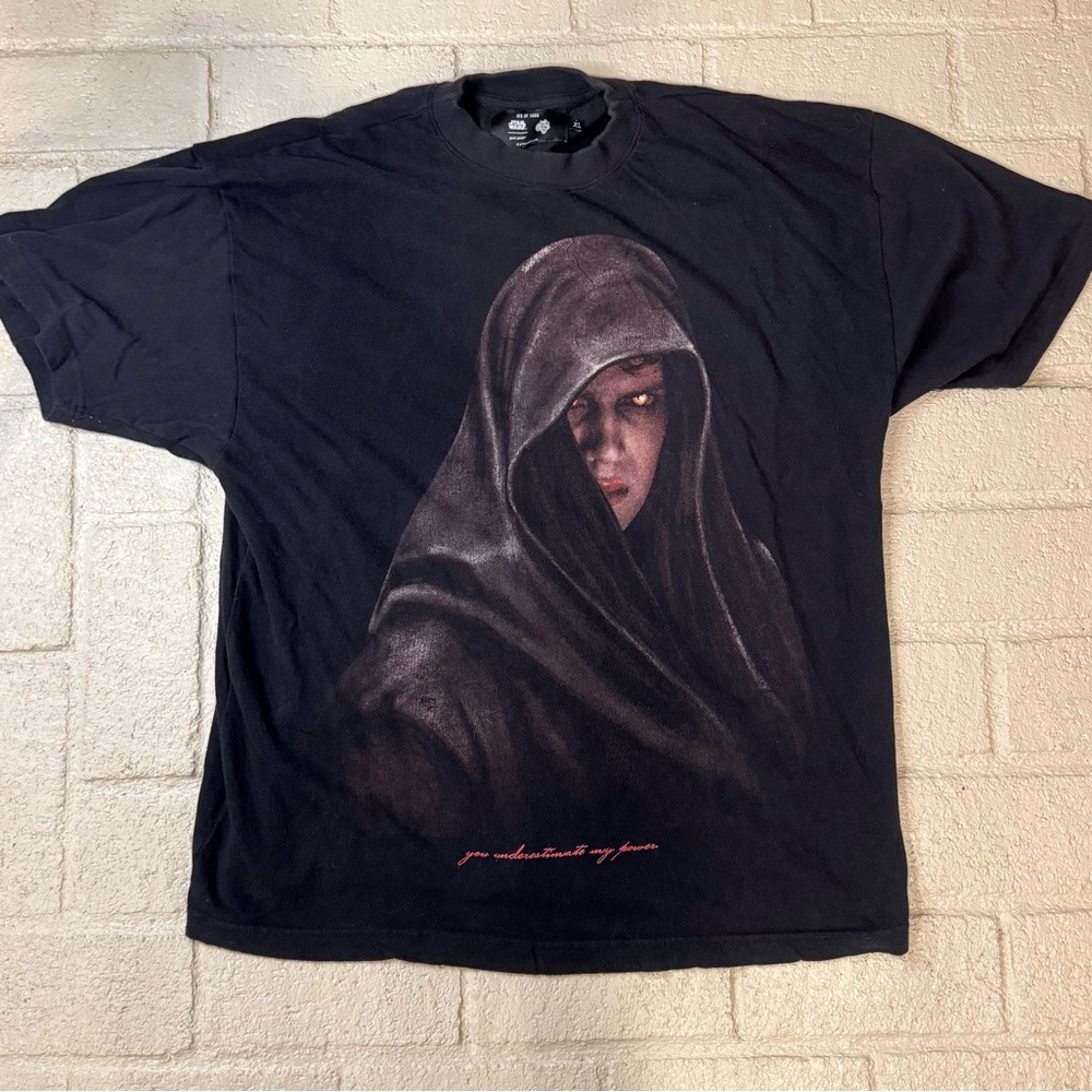 Black Graphic T-Shirt with Hooded Figure